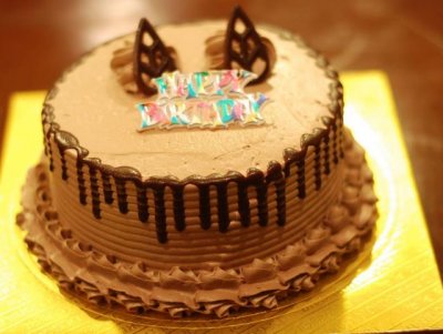 Round chocolate cream birthday cake.JPG